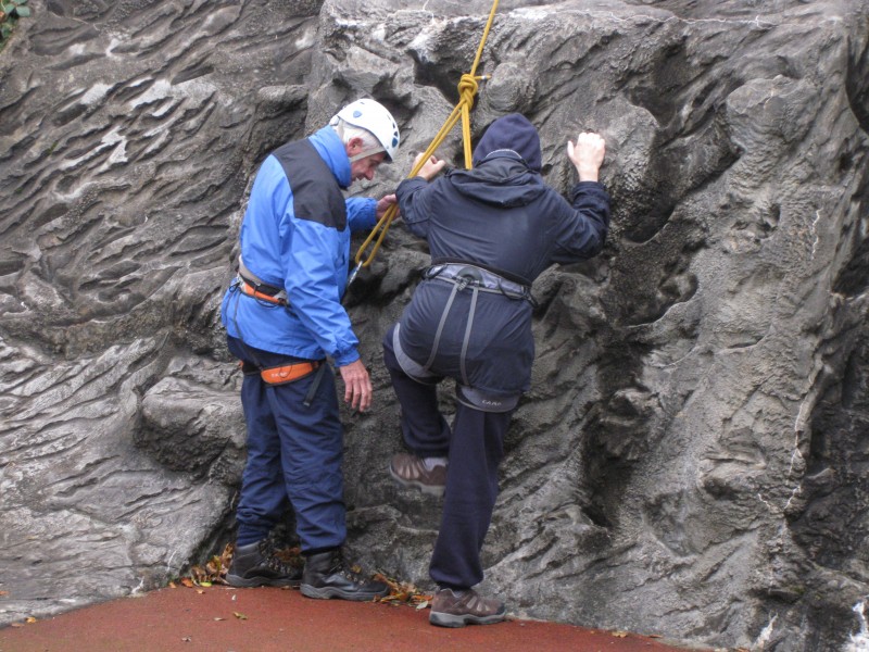 Spud helping James to begin the rock climbing