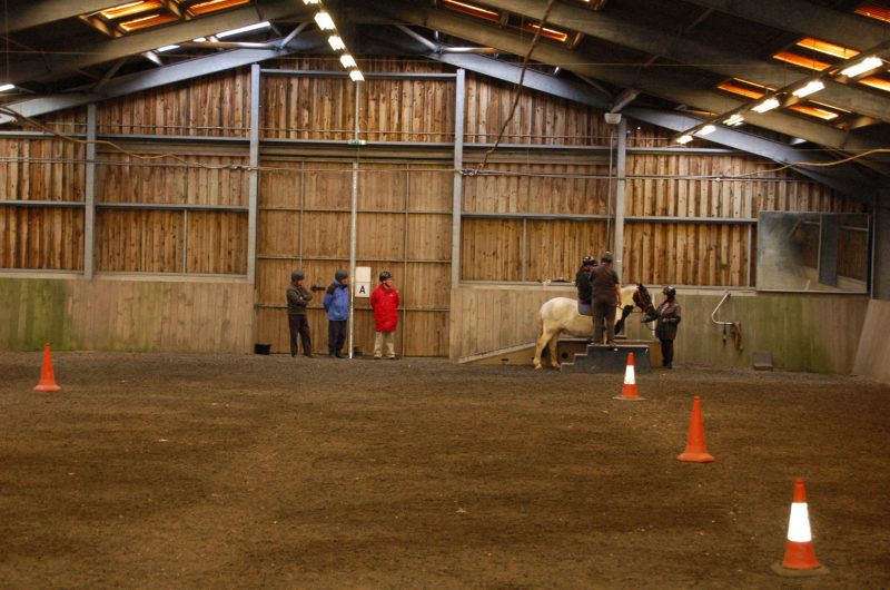 Russ, Spud &amp; Paul watching Warren mount the horse