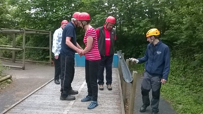 Graham Smith, Matthew Stevens, Spud Milsom and Su on the see-saw on the challenge course and Alun, our wonderful instructor, supervising. The idea was when the snooker ball was in the middle of the drainpipe they were balanced in the middle. If the base tipped because they were wriggling about on the platform and the ball fell out of the drainpipe the people on the platform had to make tea/coffee during our break time. They made the tea!