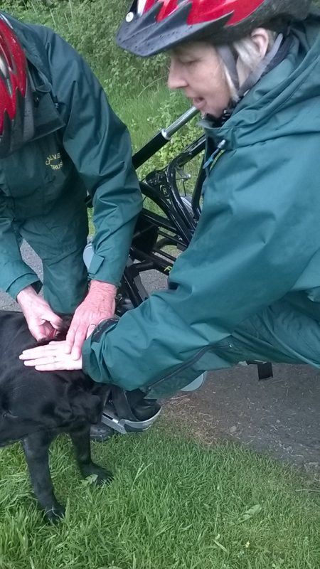 Su smoothing a rescue dog we met on our ride
