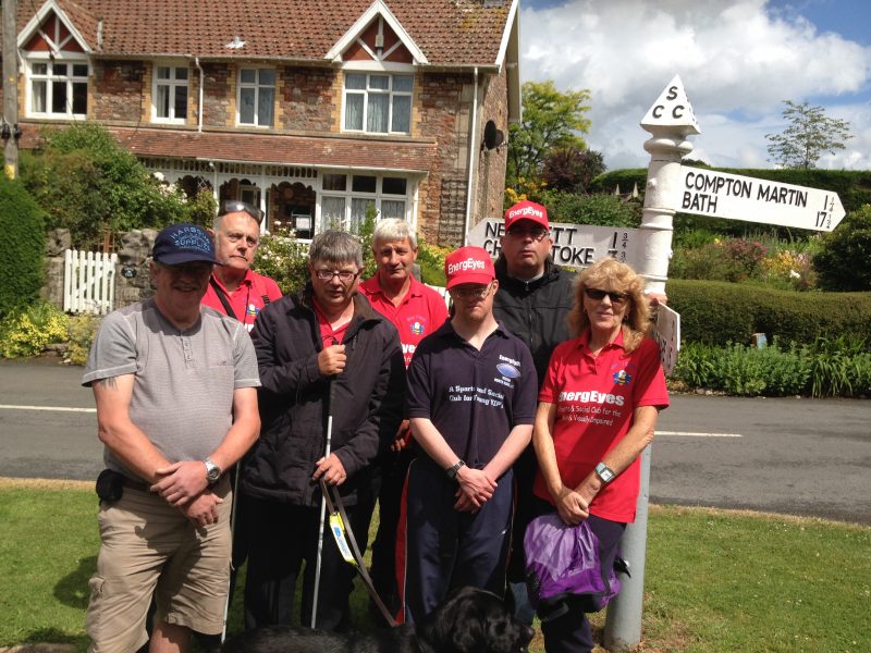 Andy Gill, Phillip, Ernest, Orla, Spud, Andrew, Matthew and Aileen stood by the signpost on Ubley Green