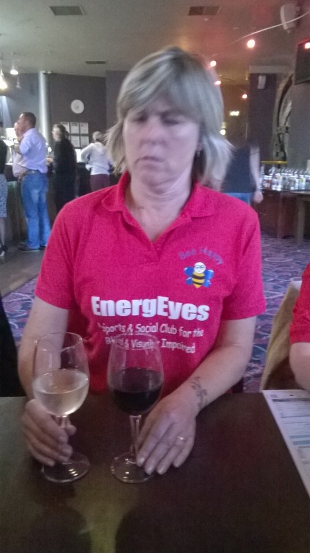 Su Camper in Wetherspoons, V- Shed, Bristol looking very puzzled as to why she has a white wine and a red wine!