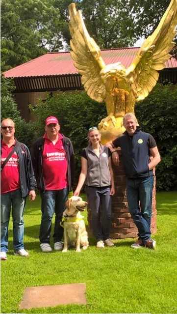 PAUL, MATTHEW, ROBIN, EMILY &amp; EMILY'S DAD STOOD BY A STATUE OF A GOLDEN EAGLE
