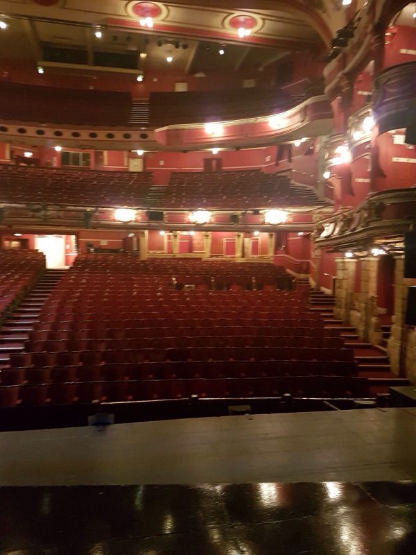 LOOKING OUT INTO THE AUDITORIUM