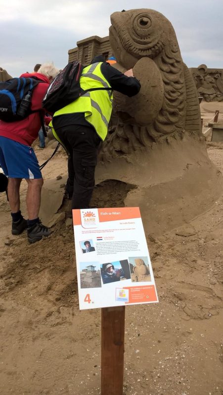 SPUD EXPLAINING THE SCULPTURE TO ERNEST - FISH-A-MAN