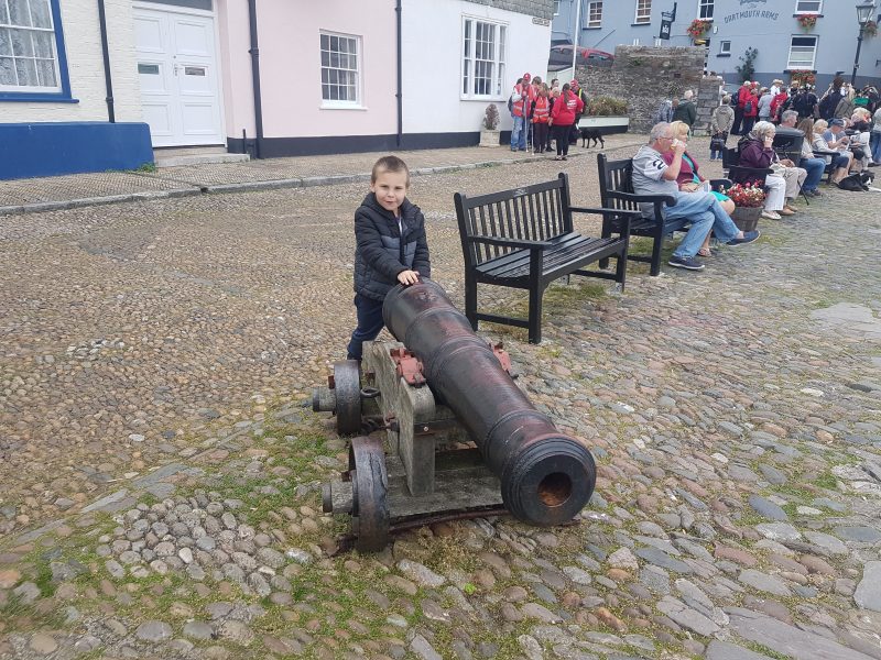 MAX HOLDING A CANNON