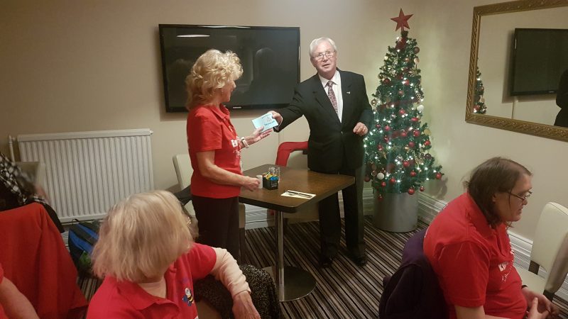 SYLVIA &amp; KIMBY IN THE FOREGROUND AND AILEEN BEING HANDED A CHEQUE FROM ALAN