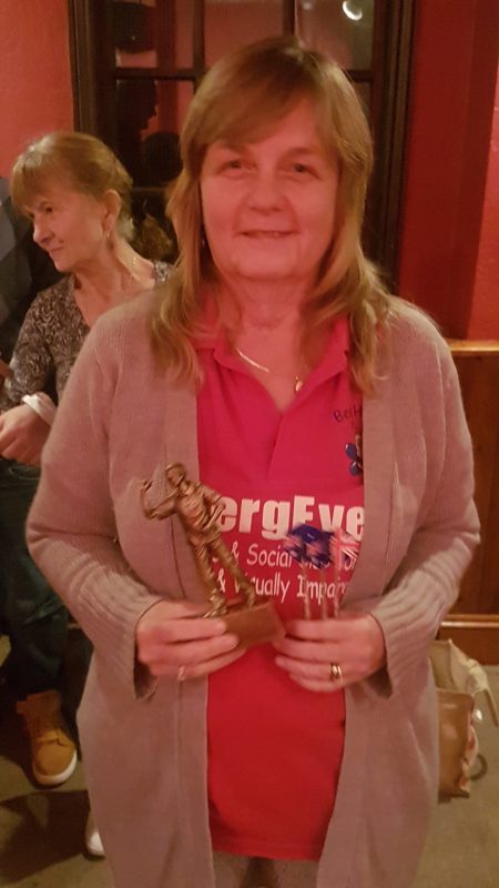 JULIE WITH HER TROPHY CUP &amp; DARTS TROPHY IN MEMORY OF MARIE, OUR VOLUNTEER.