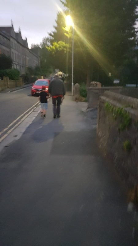 Sam guiding Dennis, a members of EnergEyes, back to his mum's car.