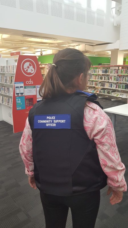 HOLLY, MICHELLE'S NIECE  WEARING THE OFFICERS JACKET.