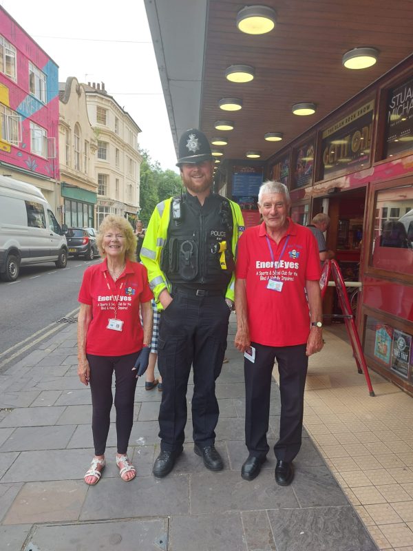 AILEEN AND SPUD STOOD NEXT TO THEIR FRIEND AARON 6FT 7 INCHES, A VERY TALL POLICEMAN