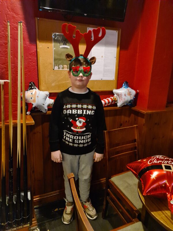SAM ZOLLER, OUR YOUNGEST VOLUNTEER,  GETTING READY FOR CHRISTMAS